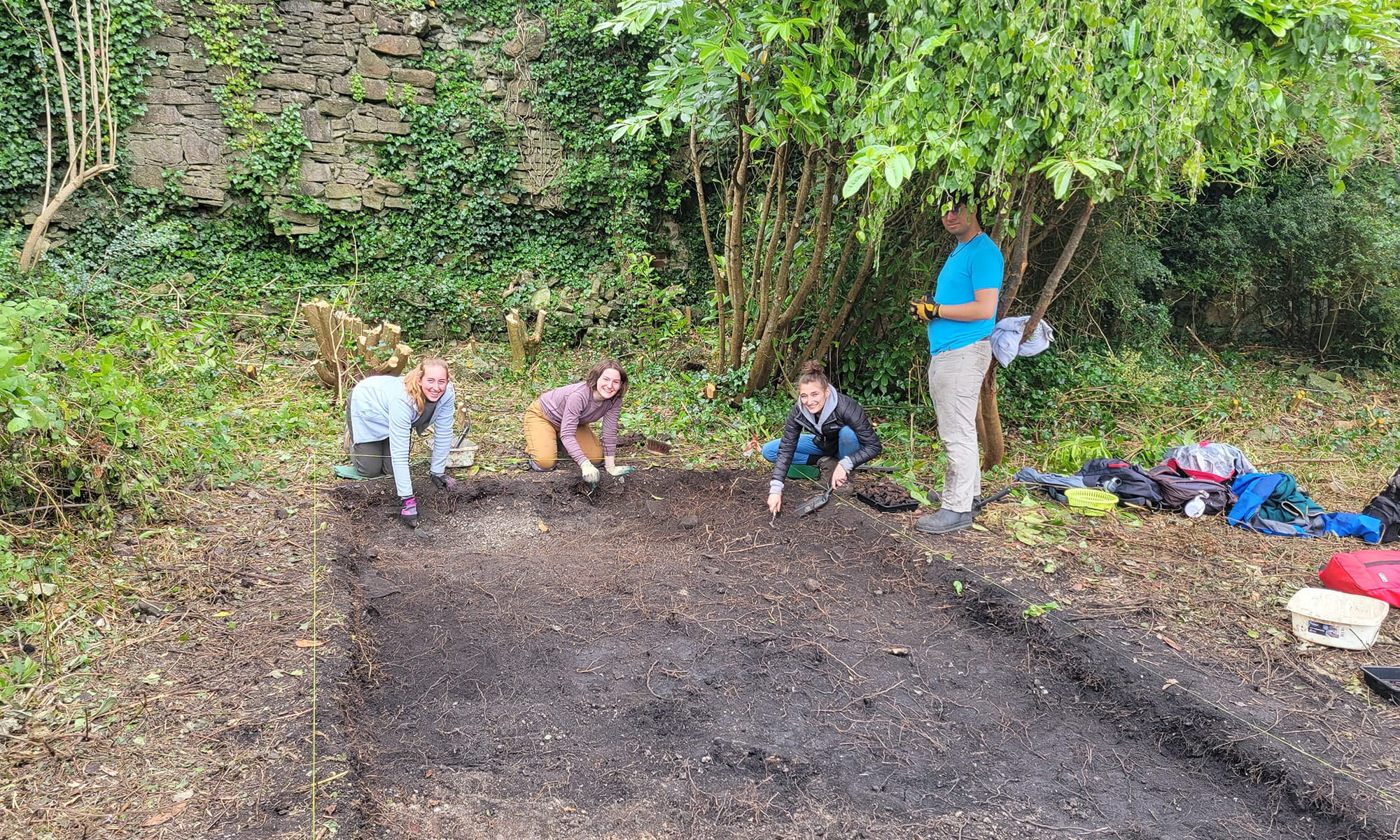 Students digging on site