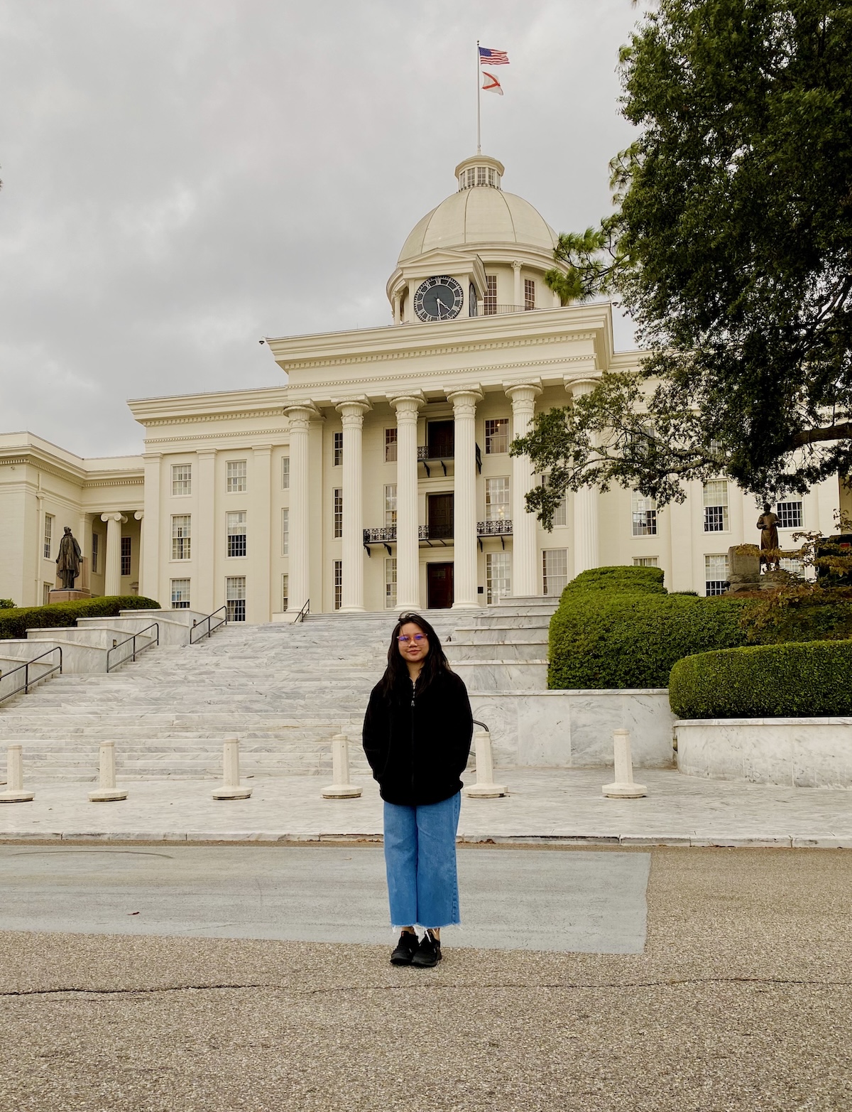 Nancy Tran '26 near the front steps of the Alabama capitol building in Montgomery