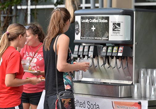Girl at soda machine