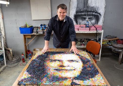 Christian Faur displays a photo-realistic portrait of American mathematician Julia Robinson that is made from crayons