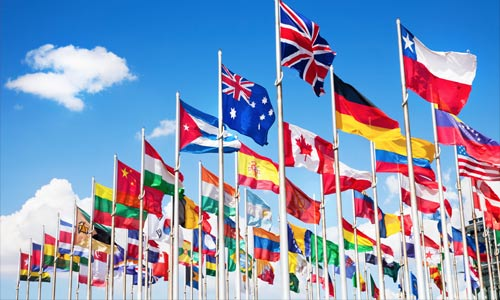Photo of different flags with the blue sky in the background