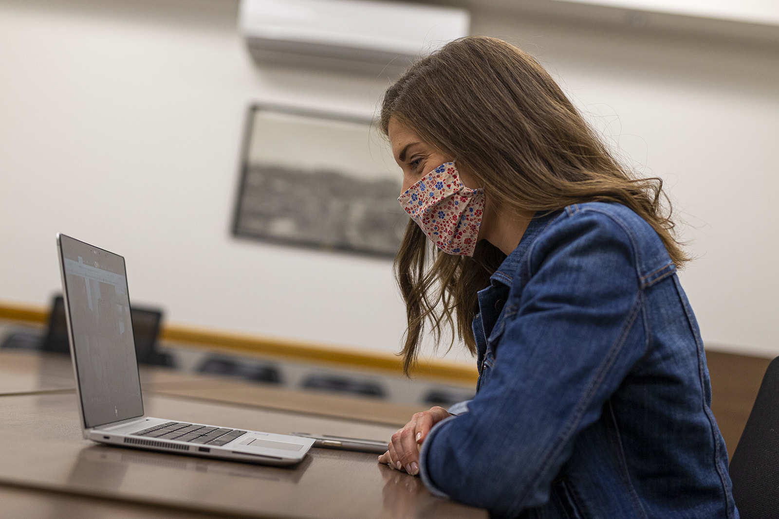 Meng in a meeting at the physical plant