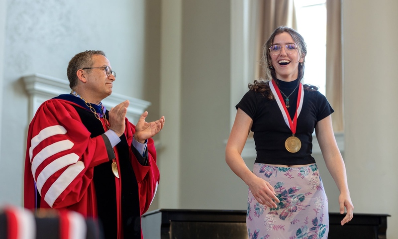 Student receiving presidents medal at academic awards convocation