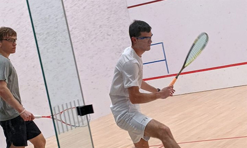Alvaro Magaña '19 practices squash in the Mitchell Athletic Center.