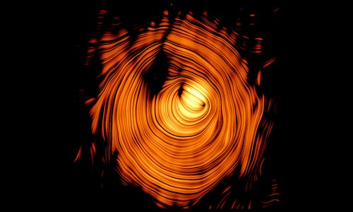 Image of the plasma jet in the blazar PKS 1424+240, seen head-on. The jet is threaded by a nearly perfect toroidal magnetic field (visualized in orange), nicknamed "The Eye of Sauron"